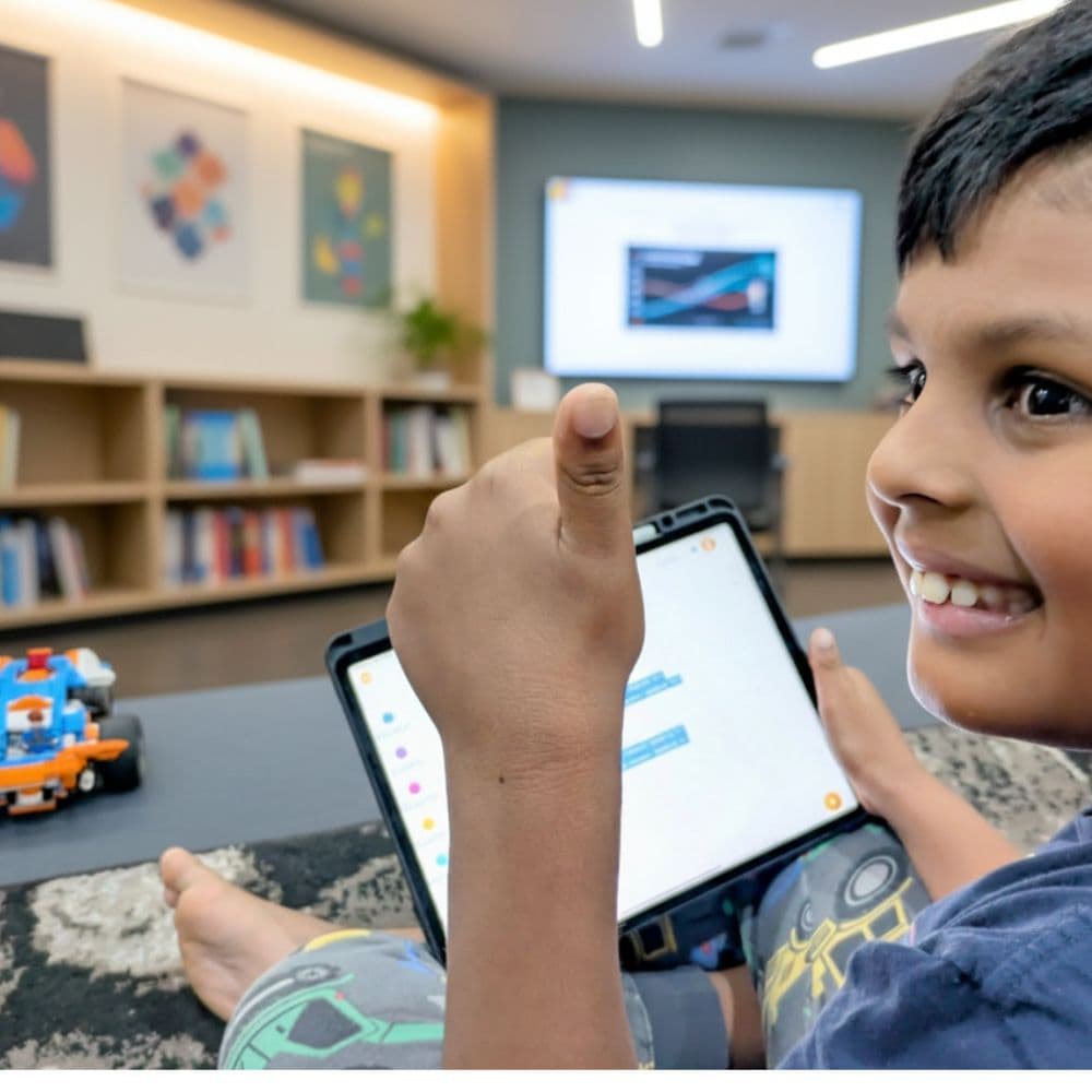 Primary school student debugging code on a laptop during a ThinkerLab coding class in Melbourne
