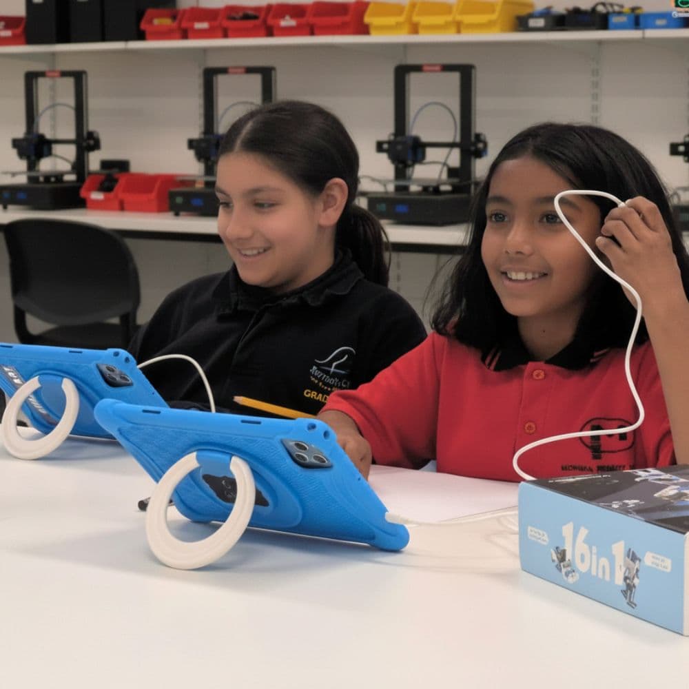Child smiling after finishing a coding project at a ThinkerLab after-school robotics club in Melbourne