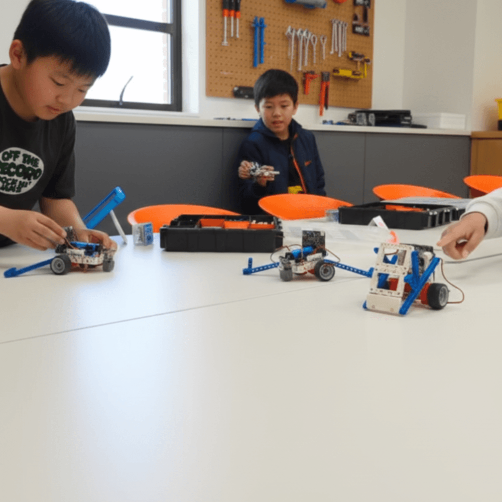 Two children collaborating to build a robot at a ThinkerLab school holiday workshop in Melbourne’s western suburbs